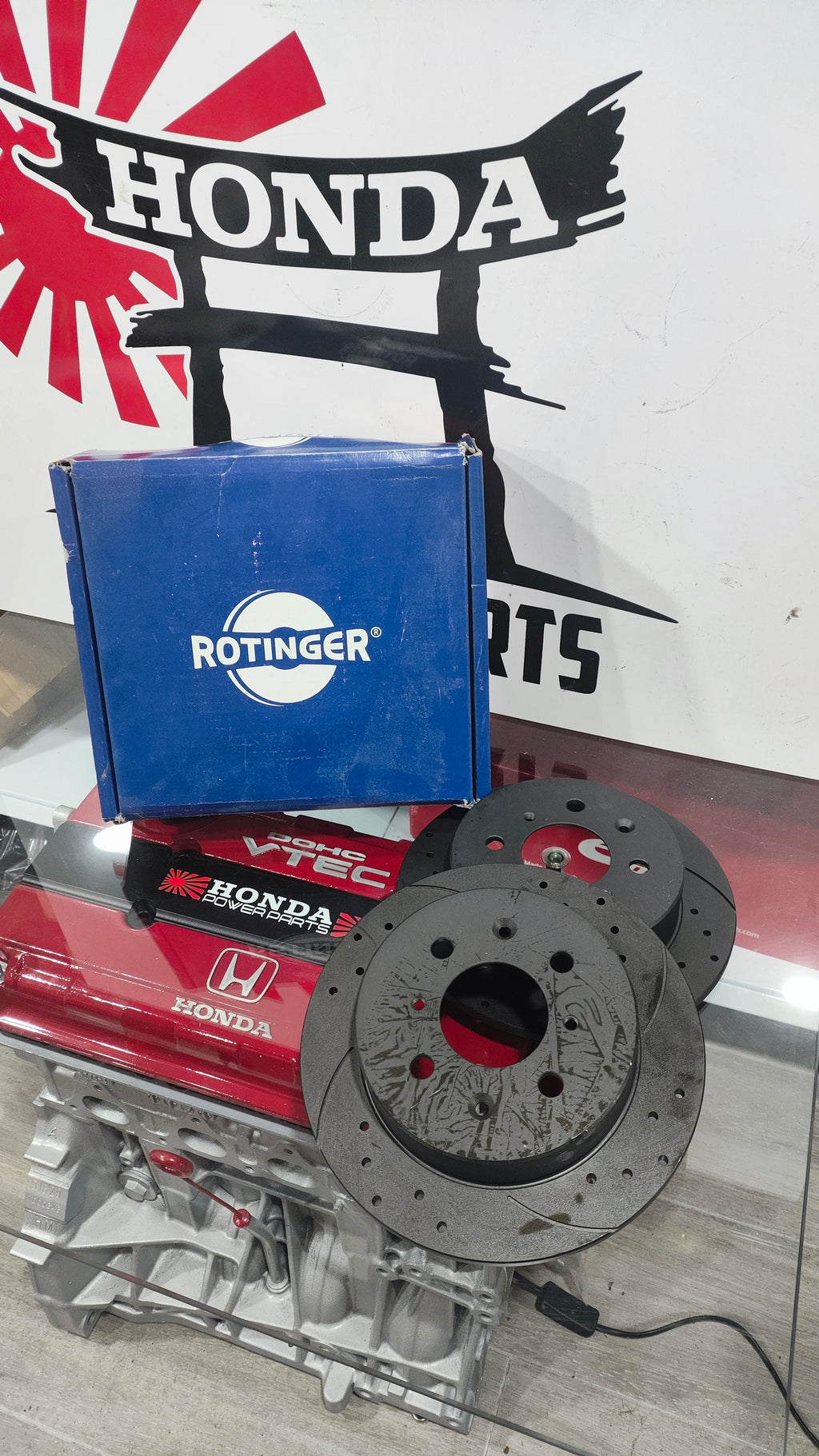 Discos Traseiros Rotinger Graphite Line T5 Sport Perfurados e Ranhurados, Pretos, 239 mm 4X100, para Honda Civic e CRX.